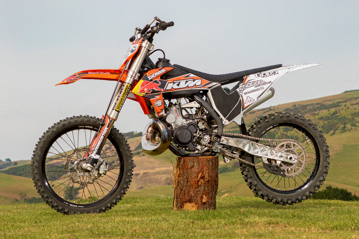 Shortened CNC swingarm installed on KTM FMX bike