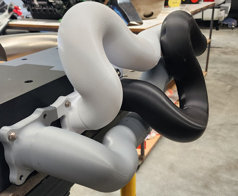 3D printed prototype of high performance exhaust manifold used to test fitment and validate design before final fabrication