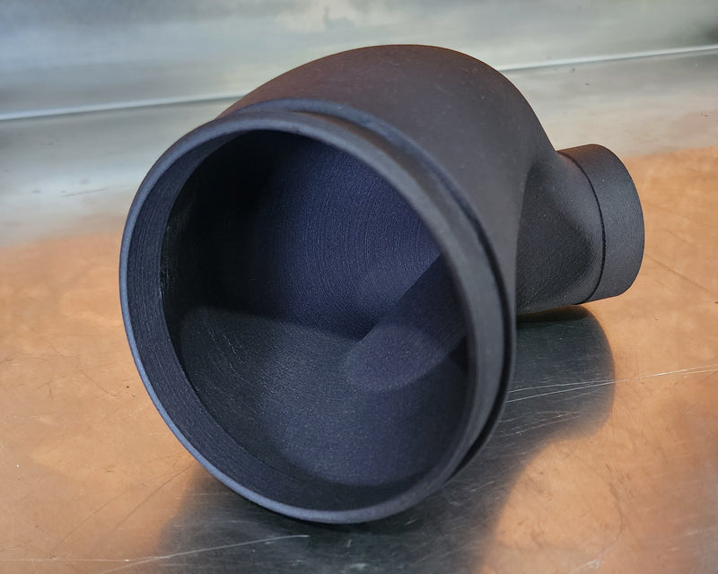 SLS 3D printed air intake for a custom FMX bike made from nylon fiberglass to improve stiffness and fitment