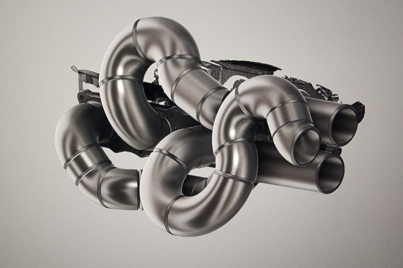 3D CAD design of custom exhaust manifold showing equal length runners and tight engine bay packaging