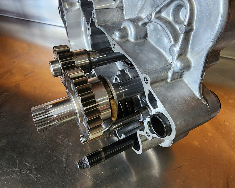 Custom single speed KTM 250 SX transmission built for freestyle motocross to reduce rotational mass, save weight, and improve in air handling