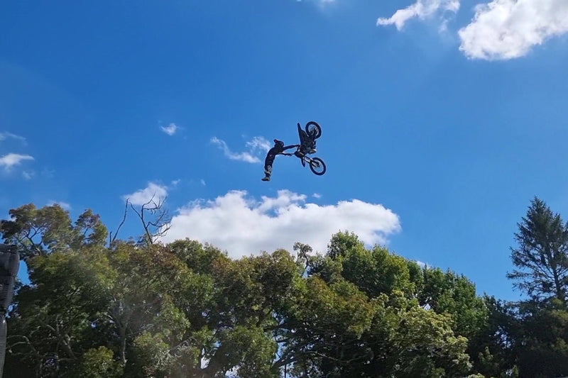 Shogun FMX Bike performing a ruler flip, showing the agility, balance, and FMX specific design of the custom build