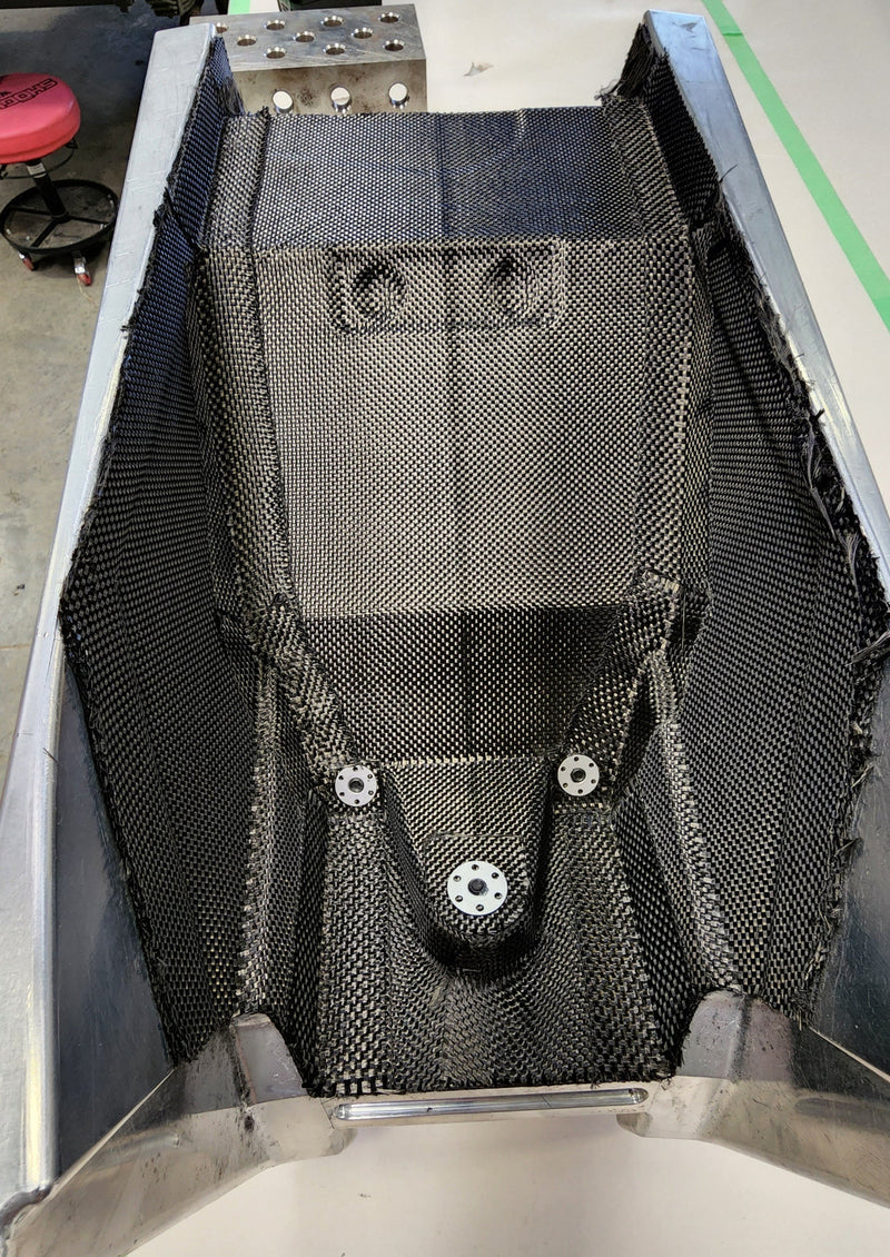 Split billet aluminum mold assembled around the carbon fiber subframe section for the Shogun FMX Bike