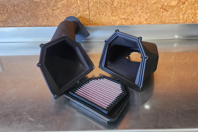Custom two piece SLS 3D printed cold air intake with K&N high flow air filter, designed for tight engine bay fitment and optimal airflow