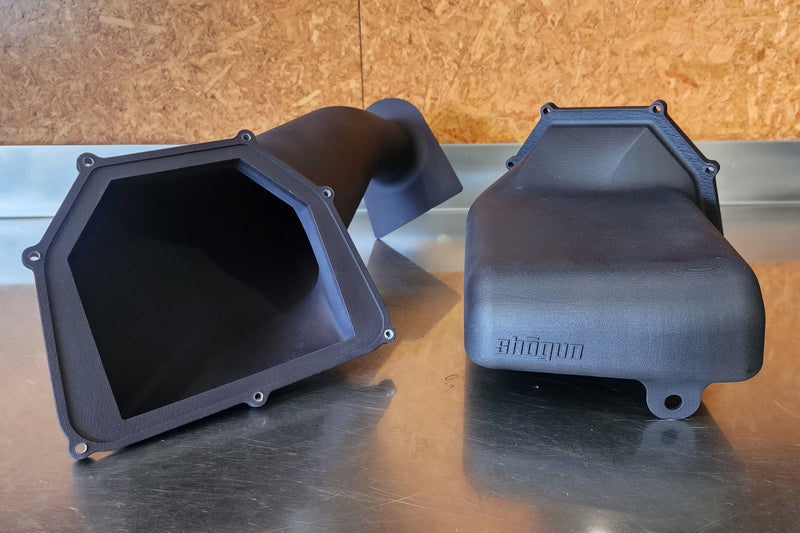 Custom cold air intake shown in two sections, SLS 3D printed in nylon fiberglass for precise fit, strength, and high airflow performance