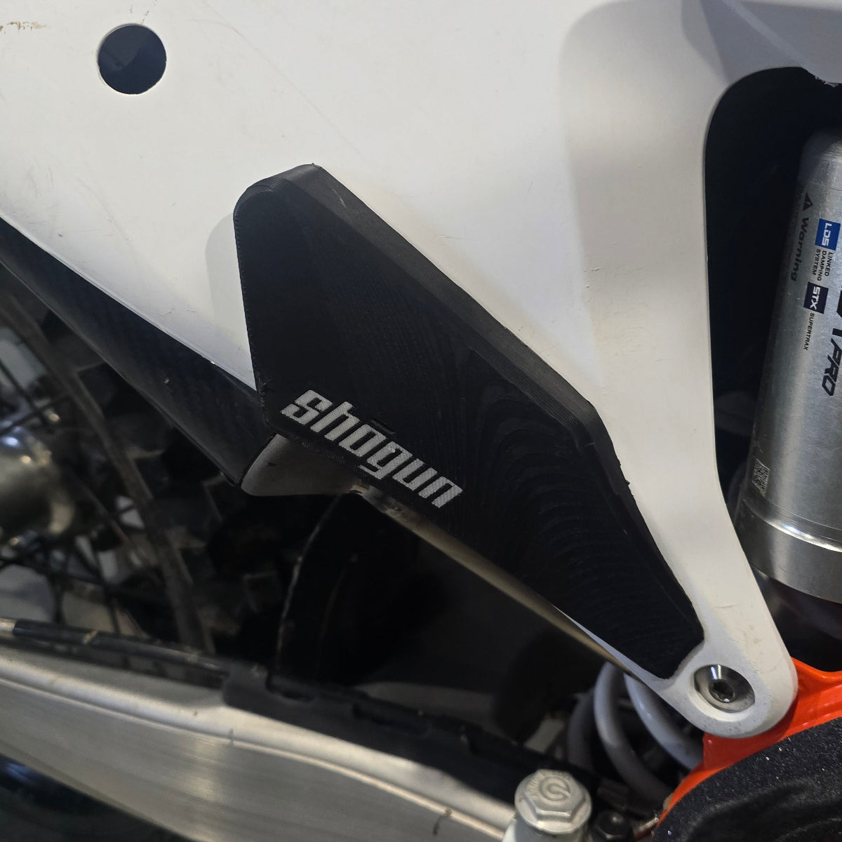 KTM MX and FMX side plate grips mounted to the factory side plastics
