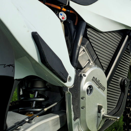 Stark VARG MX and FMX side plate grips mounted to the factory side plastics